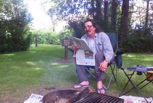 Gary telling a story, while reading the paper