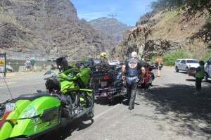 Waiting with a group of riders to cross the dam